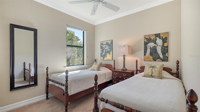 bedroom featuring carpet floors, ceiling fan, baseboards, and crown molding