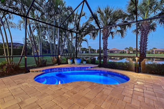 pool featuring a lanai, a water view, and a patio