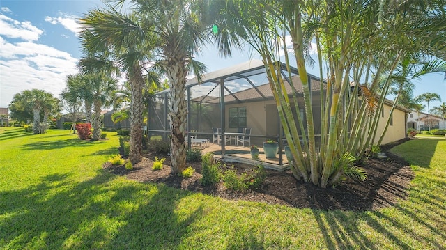 view of yard featuring glass enclosure