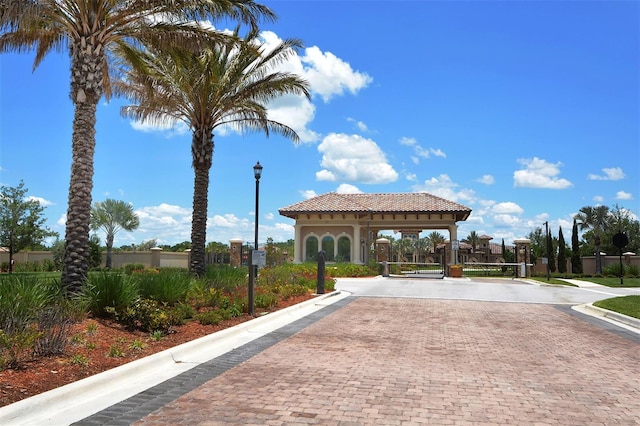 view of property's community with a gate and fence