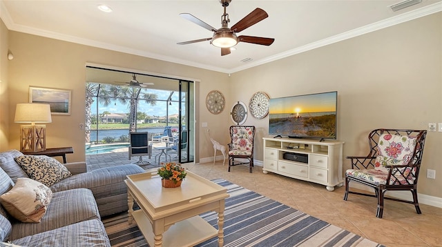 living area featuring light tile patterned floors, ornamental molding, visible vents, and baseboards