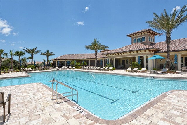 community pool with a patio area