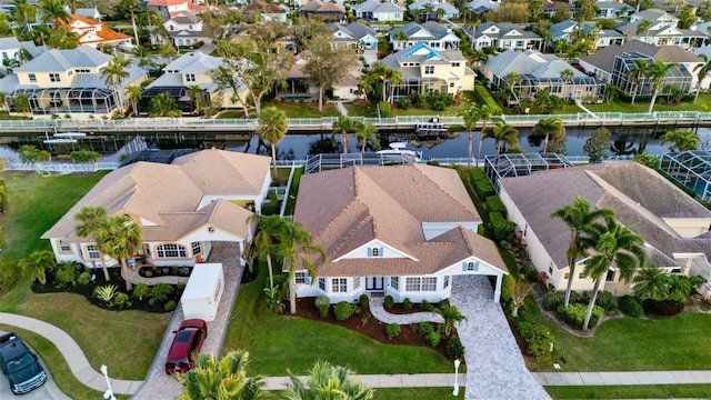 aerial view with a residential view and a water view