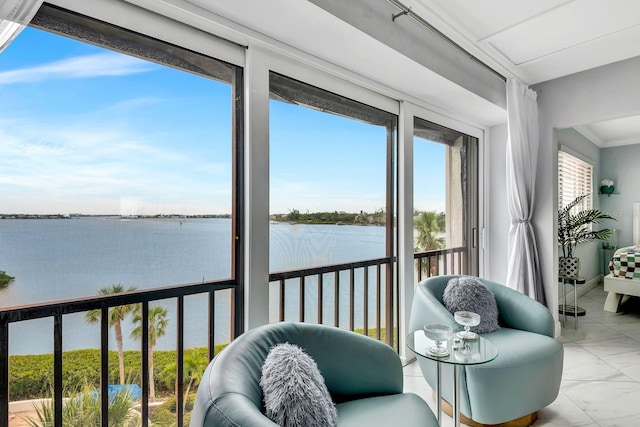 sunroom with a water view