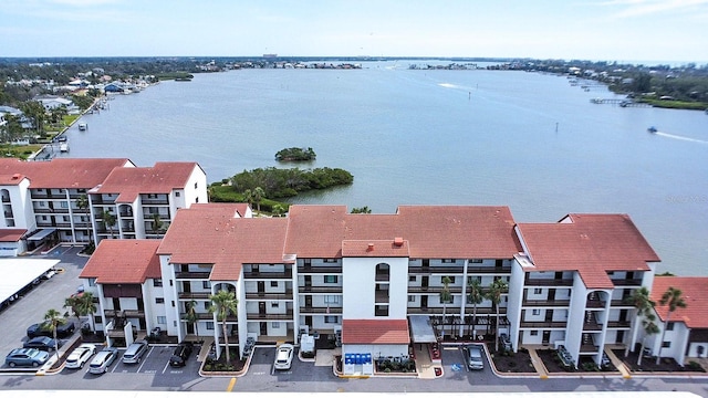 birds eye view of property with a water view