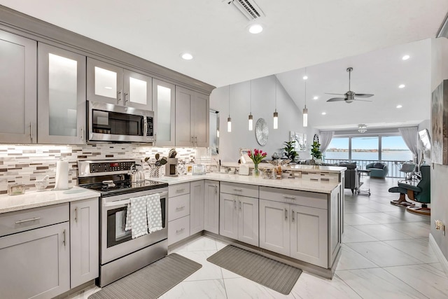 1602 Stickney Point Rd Unit 404, Sarasota, FL 34231 - kitchen featuring stainless steel appliances, gray cabinets, a peninsula, ceiling fan, and recessed lighting