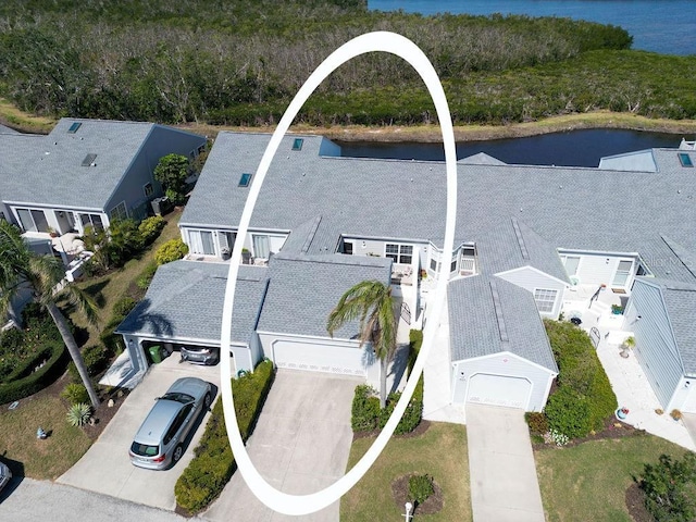 birds eye view of property featuring a water view