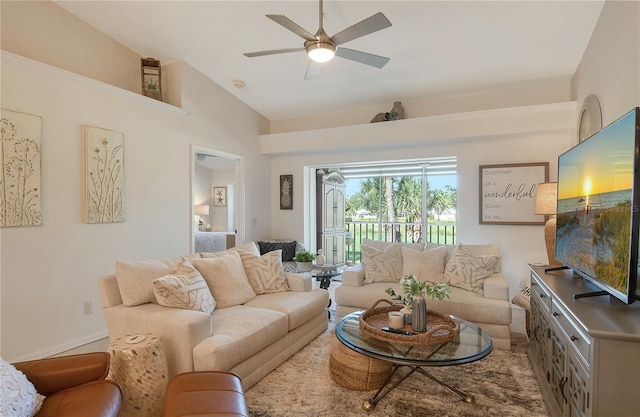 living room with ceiling fan and lofted ceiling