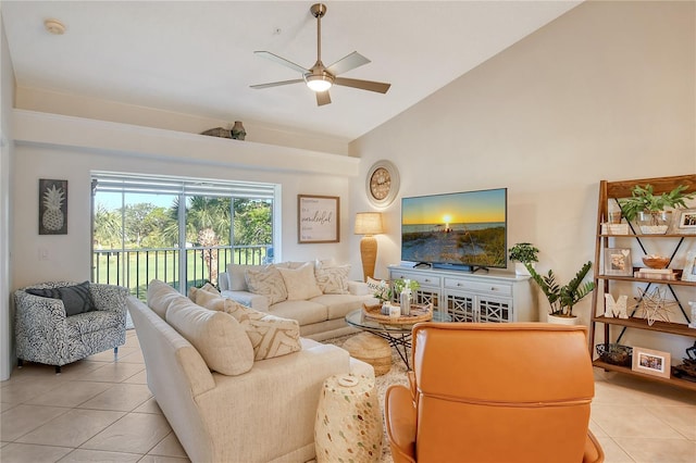 living room featuring high vaulted ceiling, light tile patterned floors, and ceiling fan