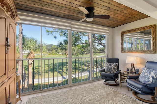 sunroom / solarium with wood ceiling and ceiling fan