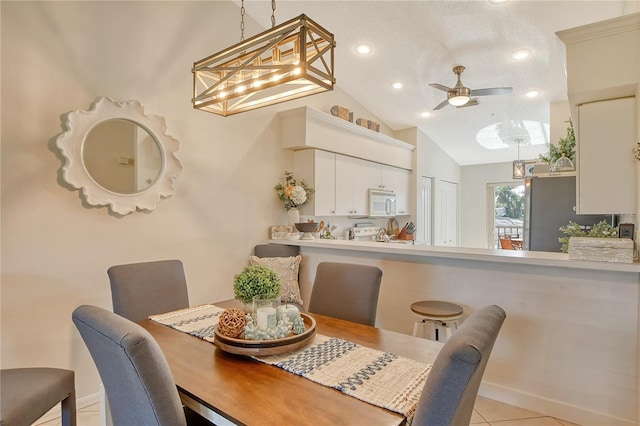 dining space featuring light tile patterned floors, recessed lighting, ceiling fan, and vaulted ceiling