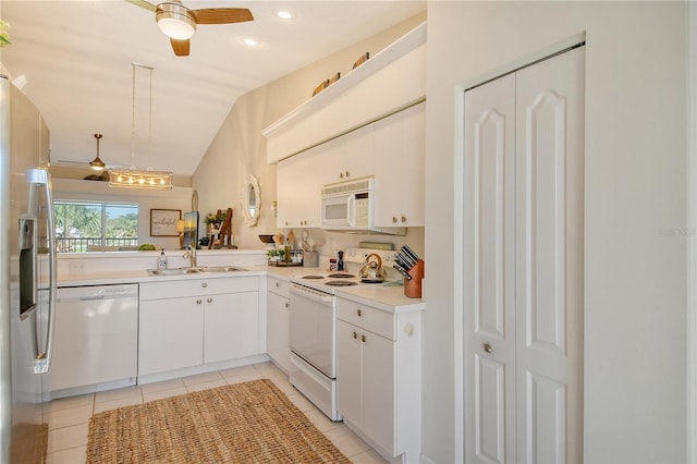 kitchen with a ceiling fan, a sink, white appliances, light countertops, and light tile patterned floors