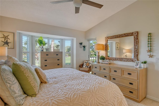 bedroom with vaulted ceiling and a ceiling fan