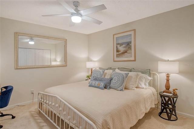 bedroom featuring baseboards, carpet, and a ceiling fan