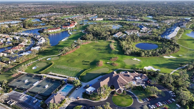 bird's eye view with a residential view, a water view, and view of golf course