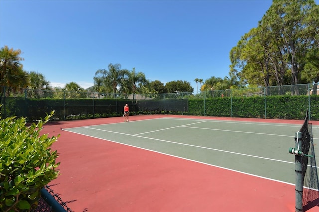 view of sport court with community basketball court and fence