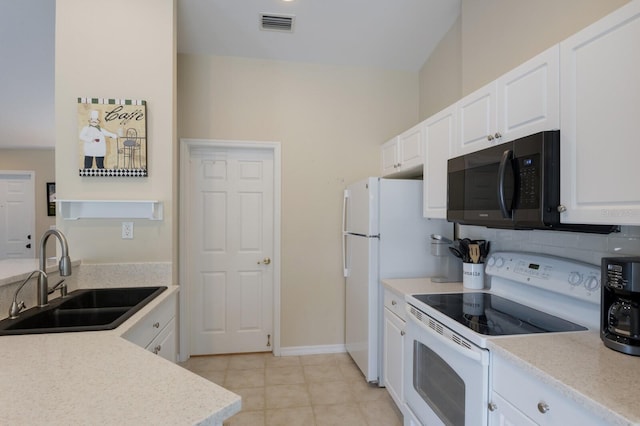 kitchen with visible vents, decorative backsplash, white cabinets, a sink, and white appliances