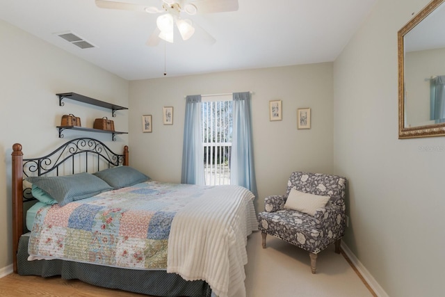 bedroom with baseboards, visible vents, and a ceiling fan