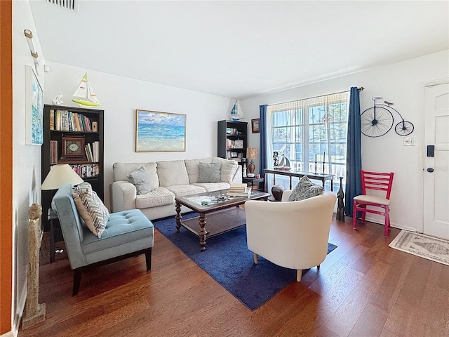 living room featuring dark wood-type flooring