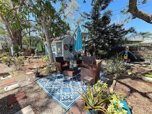 view of patio featuring an outbuilding