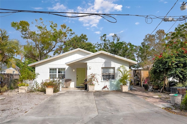 view of front of home featuring fence