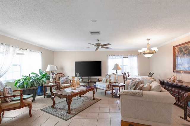 living room with ceiling fan with notable chandelier, crown molding, a textured ceiling, and light tile patterned floors