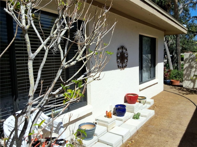 view of side of home featuring stucco siding