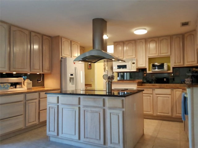 kitchen featuring light tile patterned floors, white appliances, a kitchen island, visible vents, and island exhaust hood