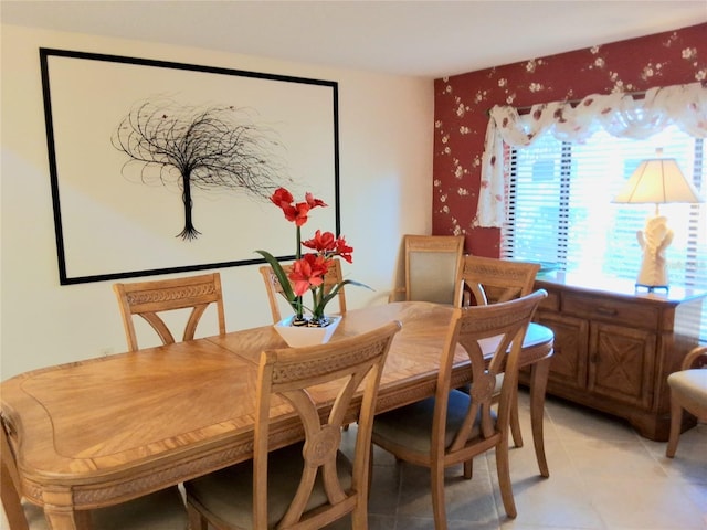 dining area featuring light tile patterned floors