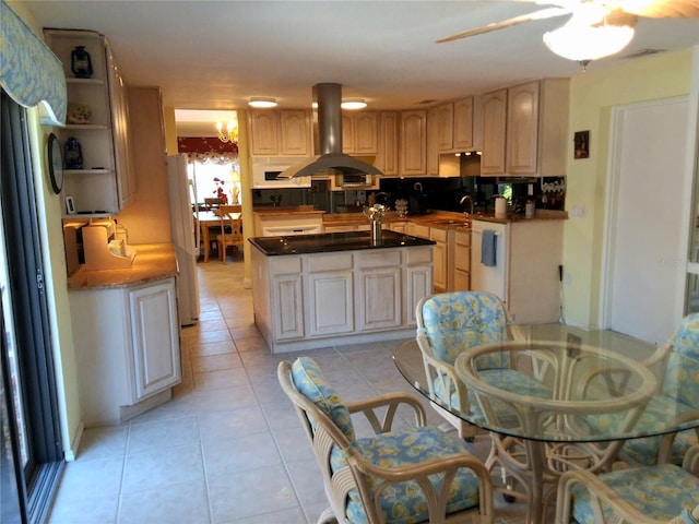 kitchen with light tile patterned floors, a kitchen island, ventilation hood, open shelves, and a sink