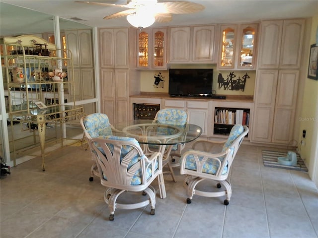 dining area with light tile patterned floors and ceiling fan