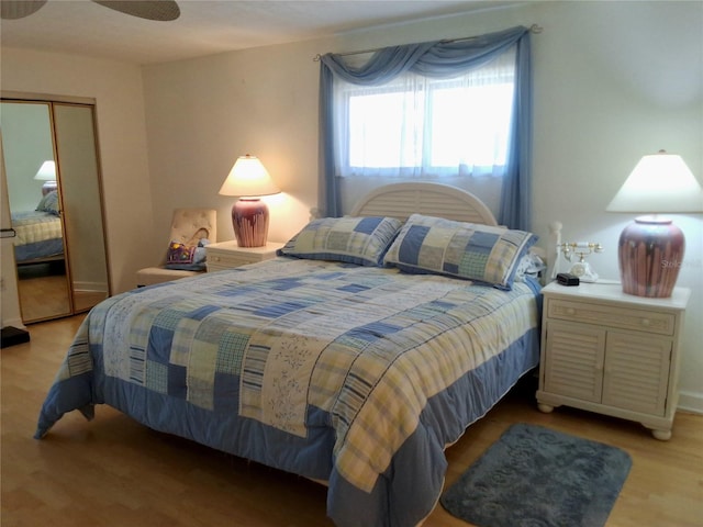 bedroom with a closet and wood finished floors