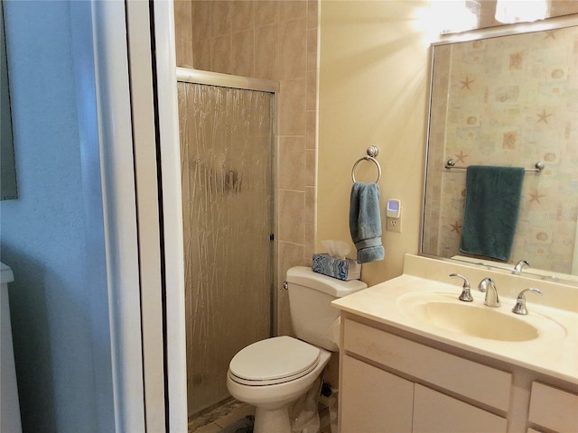 bathroom with toilet, a shower with shower door, and vanity