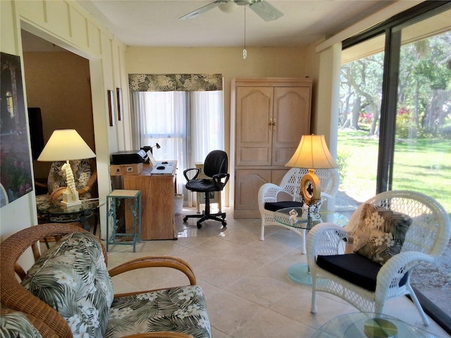 living room featuring a ceiling fan, plenty of natural light, and light tile patterned floors