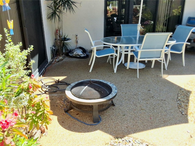 view of patio featuring a fire pit