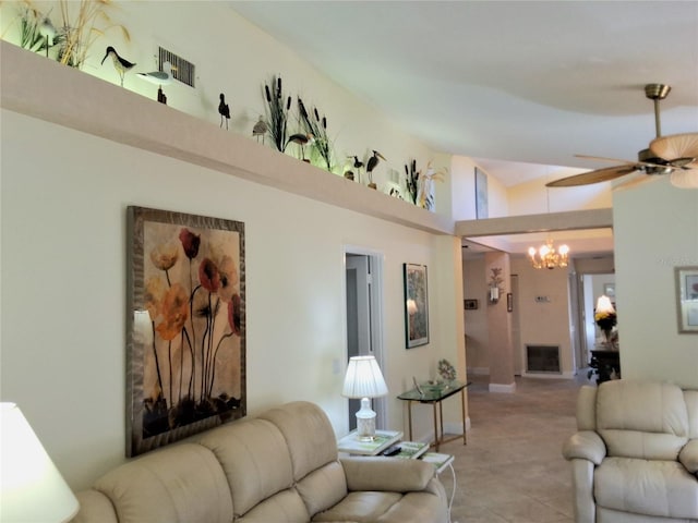 3818 Sun Eagle Ln, Bradenton, FL 34210 - living room with visible vents, lofted ceiling, and ceiling fan with notable chandelier