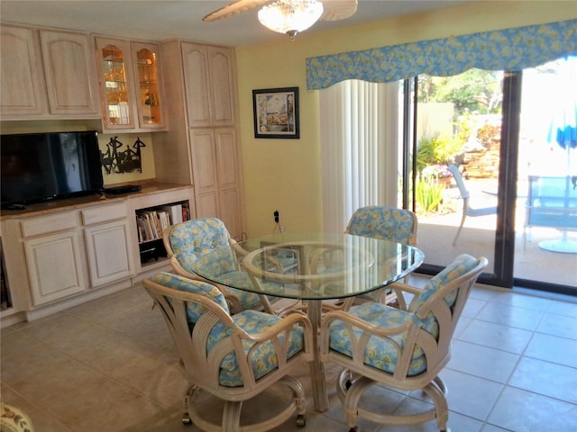 3818 Sun Eagle Ln, Bradenton, FL 34210 - dining space with light tile patterned floors and ceiling fan
