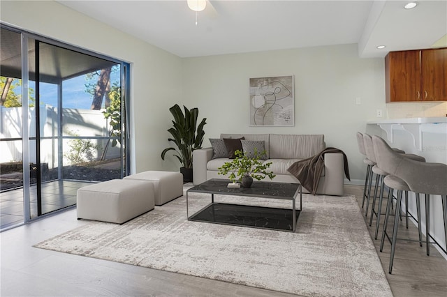 living room with wood finished floors and recessed lighting