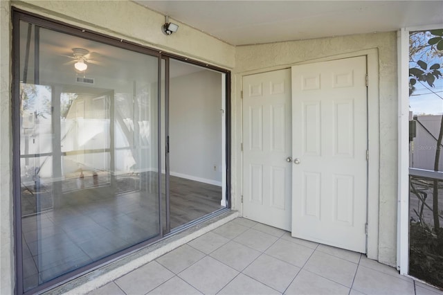 interior space featuring a ceiling fan and visible vents