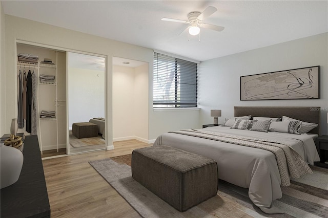 bedroom with a ceiling fan, a closet, light wood-style flooring, and baseboards