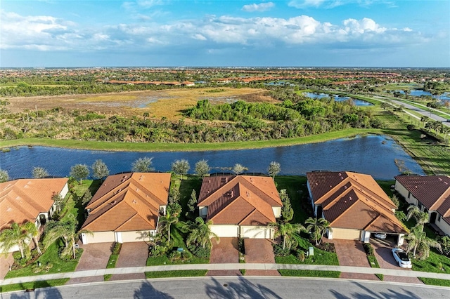 bird's eye view with a water view and a residential view