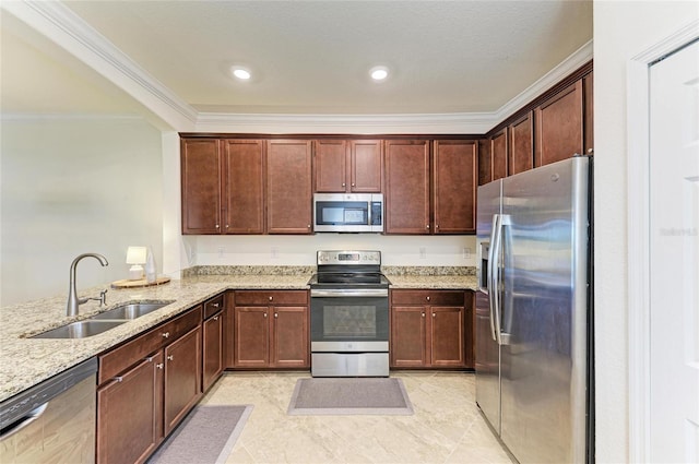 kitchen with light stone counters, recessed lighting, stainless steel appliances, a sink, and ornamental molding