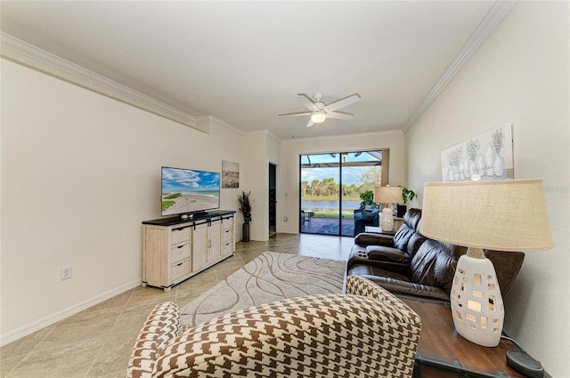 living area with baseboards, light tile patterned floors, a ceiling fan, and crown molding