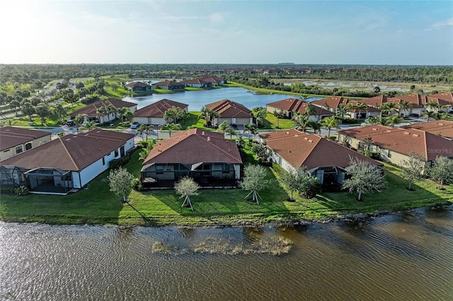 aerial view featuring a water view and a residential view