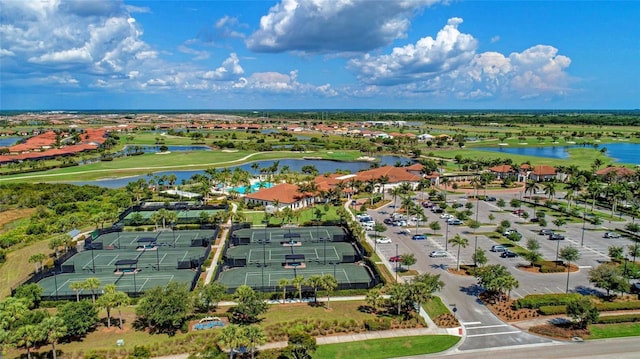 birds eye view of property featuring view of golf course and a water view