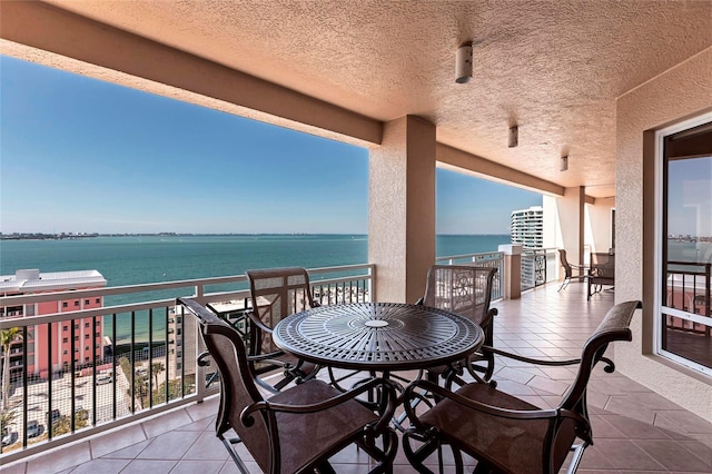 balcony featuring a water view