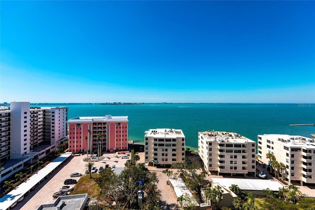 birds eye view of property featuring a view of city and a water view