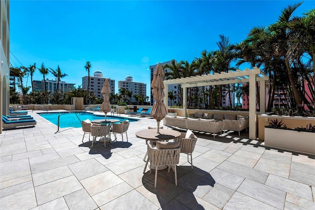 pool featuring an outdoor hangout area, a pergola, and a patio area