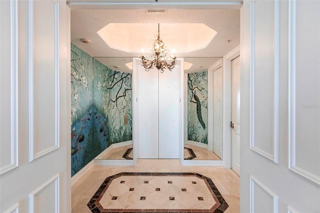 35 Watergate Dr Unit 1103, Sarasota, FL 34236 - bathroom with inlaid floor details, a chandelier, wallpapered walls, and a raised ceiling