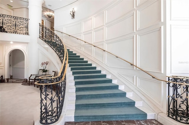 35 Watergate Dr Unit 1103, Sarasota, FL 34236 - stairway with a high ceiling and decorative columns